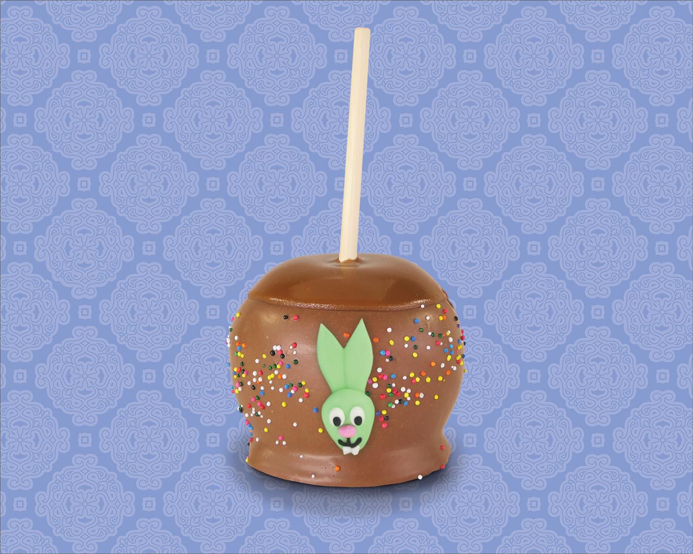 Easter decorated milk chocoalte dipped caramel apple with sprinkles