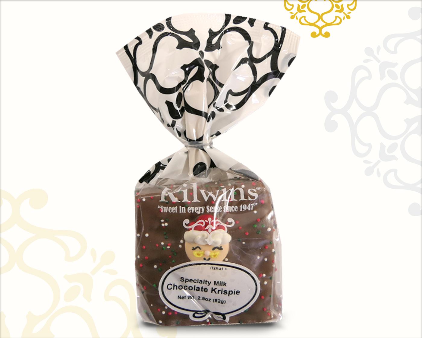 chocolate covered krispie treat with sprinkles & a Holiday icing topper decoration