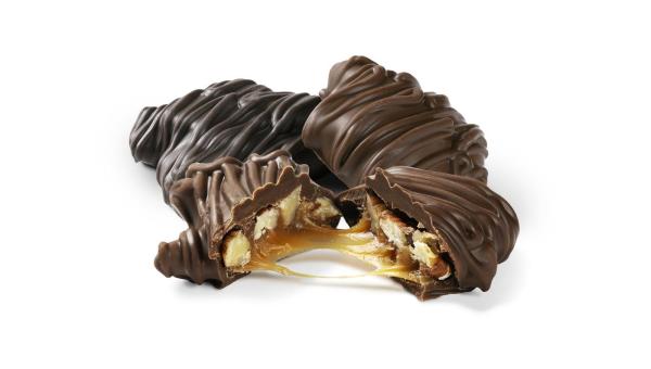 pile of milk chocolate pecan TUTTLE Nut Caramels