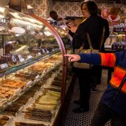 Photo of little boy pointing into Ice Cream case