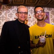 Photo of father and son holding dish of Ice Cream