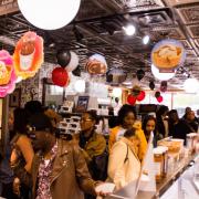 Photo of customers standing in line at Ice Cream case