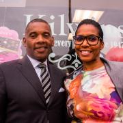 Photo of man and woman standing in front of Kilwins Chicago - Michigan Ave. store