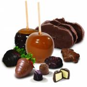 Photo of an array of Kilwlins products featuring Fudge, Caramel Apples, Tuttles, Truffles, and Chocolate-Dipped Strawberries